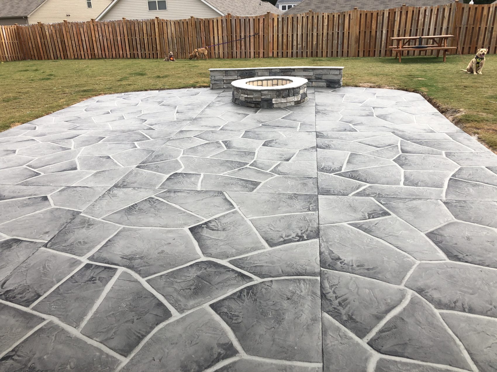 Stamped flagstone concrete patio with fire pit