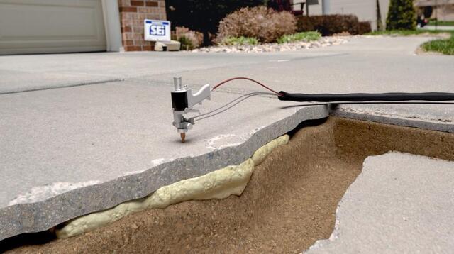 Cutaway view of polyurethane foam filling voids beneath a driveway