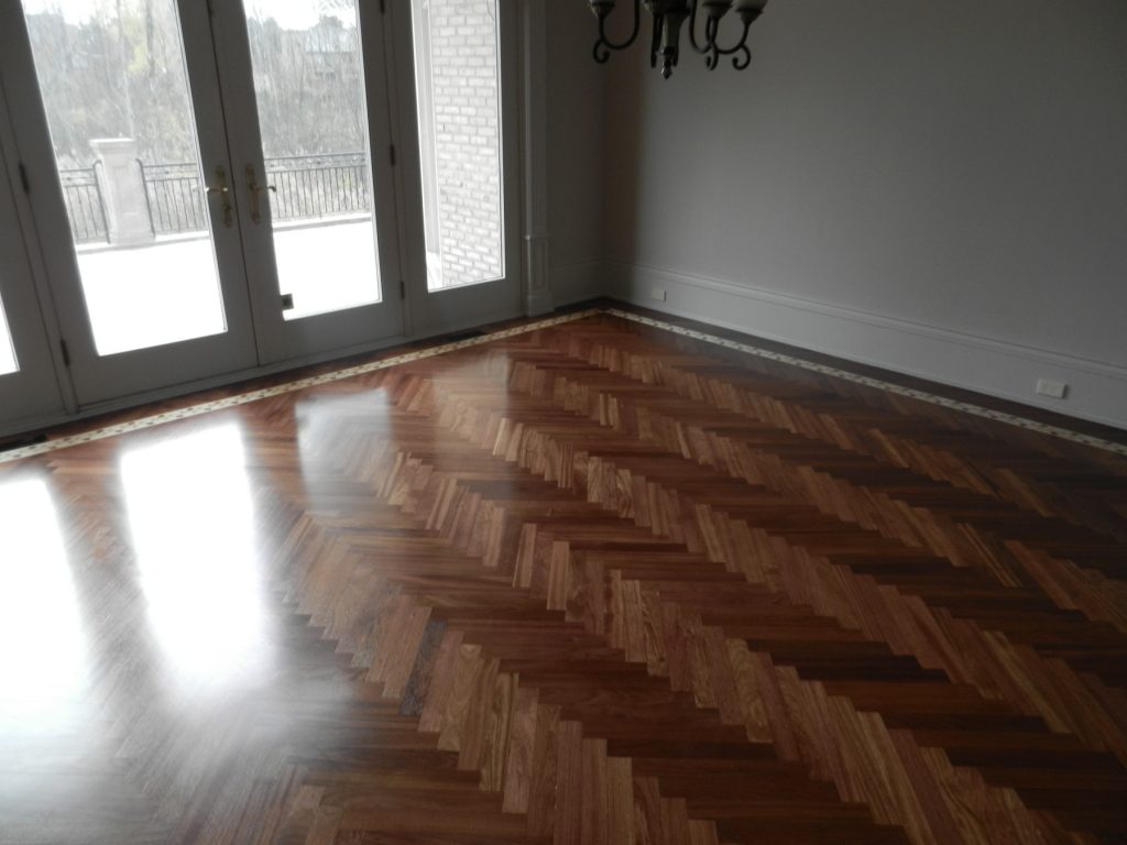 Dark stained herringbone hardwood floor